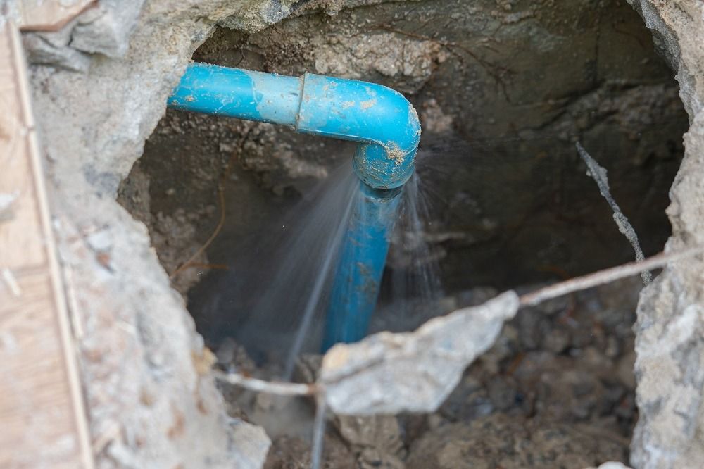 water leaks from pipe, formerly underground